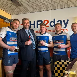 Mark Jolley posing with Darlington Mowden Park Rugby Club players